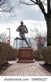 PISCATAWAY, NEW JERSEY - January 4, 2017: A View Of The Football Player Sculpture On The Scarlet Walk At Rutgers University Busch Campus