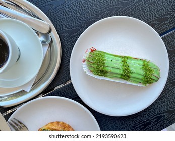 Pistachio Eclair On A Brunch Table