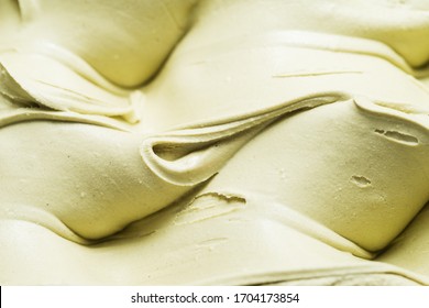 Pistachio flavour gelato - full frame detail. Close up of a creamy green surface texture of Pistachio Ice cream. - Shutterstock ID 1704173854