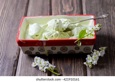 Pistachio Ice Cream In A Big Container, Bird Cherry Flowers