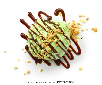 Pistachio Ice Cream Decorated With Melted Chocolate Sauce Isolated On White Background, Top View