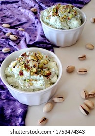 Pistachio Jello Pudding On The Table With The Purple Fabric And Pistachio Nuts