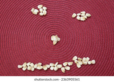 Pistachio nuts, funny nut face on red background, stylized design, I am not happy, I am sad, unhappy, dissapointed