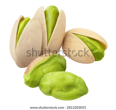 Pistachio nuts with opened shells and peeled green kernels, isolated on white background