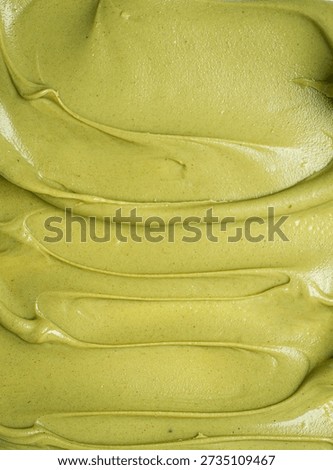 Pistachio paste texture, full frame, close-up,