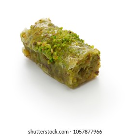 pistachio rolls baklava, fistikli sarma, turkish traditional dessert isolated on white background