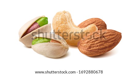 Pistachios, almonds and cashew nuts mix isolated on white background. Package design element with clipping path