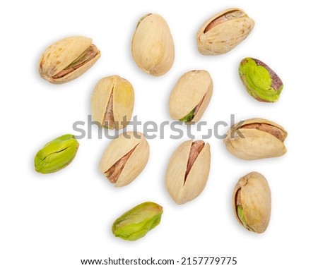Pistachios. Nuts pistachios in shell. Roasted and salted Pistachio. Vegetarian snack. Not peeled shell. High quality photo. Macro close up food photography. Isolated on white background. 
