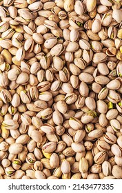 Pistachios Seeds Texture, Top View, Vertical Photo. It Has High Levels Of Unsaturated Fatty Acids And Potassium