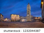 Pistoia, Italy. Panorama of Piazza del Duomo square with old Town Hall and Cathedral of San Zeno at dusk with HDR-effect