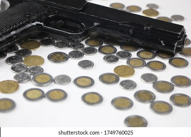 Pistol Along With Mexican Coins