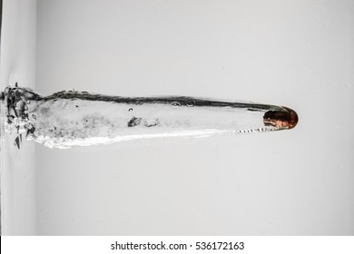 Pistol Bullet Entering Into Ballistics Gel Or Water