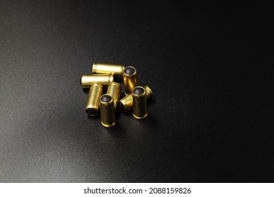 Pistol Cartridges With Rubber Bullets On A Black Background