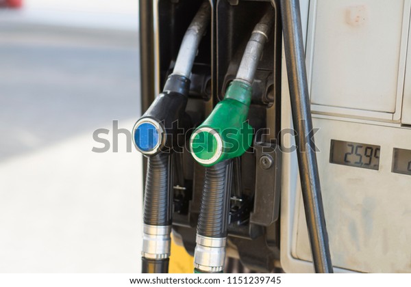 The pistol of the\
gas station is close-up.