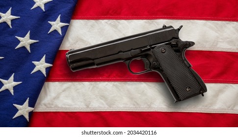 Pistol On US America Flag Background, Top View. Gun Laws In United States, Self Defence And Security Concept