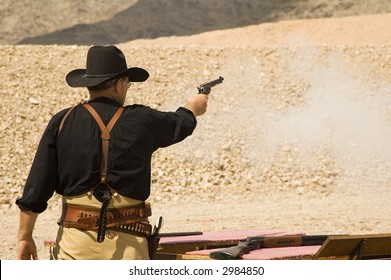 Pistol Shooting In A Cowboy Action Shooting Competition In Arizona