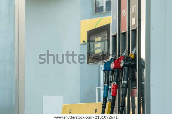 pistols at a gas station in\
close-up