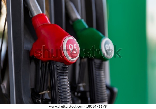 Pistols with\
gasoline at the gas station.\
Close-up.