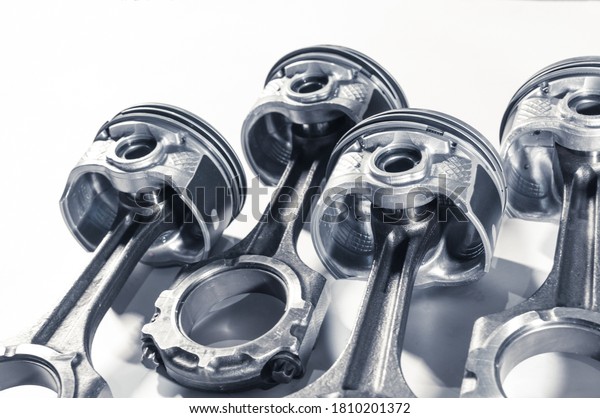 pistons with connecting rod engine car on white\
background. Close up