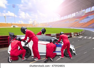  Pit Stop With Team Maintaining Technical Service For A Racing Car During Competition