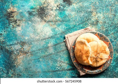 Pita Or Arabic Bread On Blue Background, Top View With Copy Space