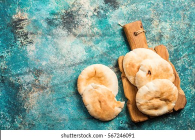 Pita Or Arabic Bread On Blue Background, Top View With Copy Space