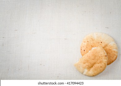 Pita Or Arabic Bread, Soft Baked Flatbread On Canvas Background With Free Space For Text