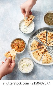 Pita With Assorted Traditional Greek Dips - Olive Tapenade, Tzatziki, Vegetable Caviar, Feta Cream Over Light Blue Background. Top View, Flat Lay. 