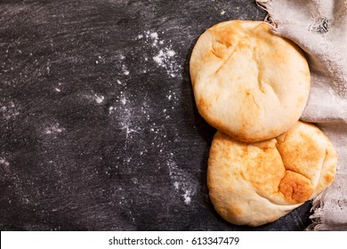 Pita Bread On Dark Table, Top View With Copy Space