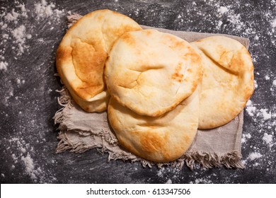 Pita Bread On A Dark Table, Top View