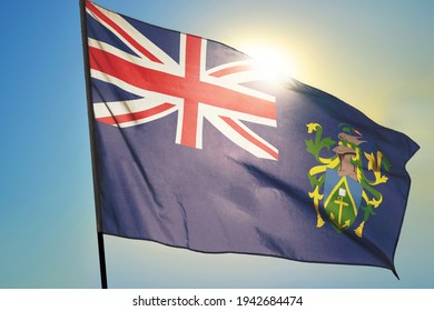 Pitcairn Islands flag waving on the wind in front of sun - Powered by Shutterstock