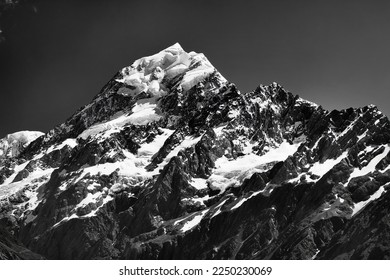 Pitch black-white dramatic view of top part ot Mt Cook peak the tallest mountain of New Zealand under dark sky. - Powered by Shutterstock