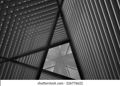 Pitched Roof Or Ceiling. Reworked Close-up Photo Of Sloped Walls. Realistic Though Unreal Industrial Interior. Abstract Black And White Background Image On The Subject Of Modern Architecture.