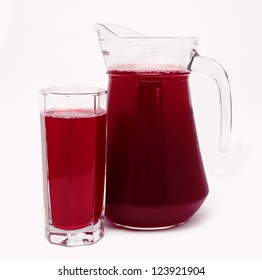 Pitcher And Glass Of Red Fruit Juice Isolated On White Background
