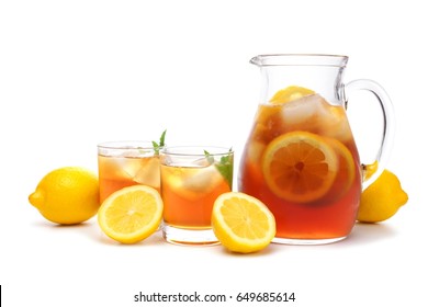 Pitcher Of Iced Tea With Two Glasses And Lemons Isolated On A White Background