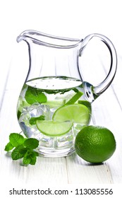 pitcher of lemonade with lime and mint