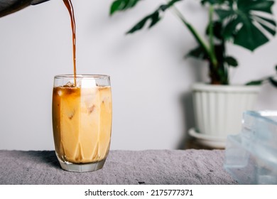 a pitcher Pour brewed coffee and brew cold black coffee on a mug of homemade coffee