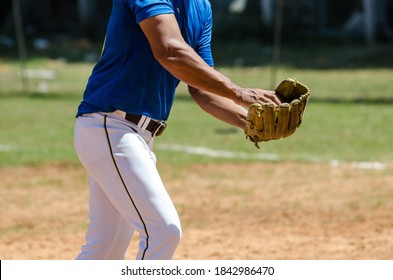 Pitcher Softball Player Holding Softball In Hand Ready to Throw the Ball Color - Powered by Shutterstock