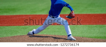 Pitcher and third baseman during a baseball game