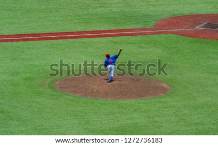 Pitcher and third baseman during a baseball game. Top view.