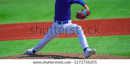 Pitcher and third baseman during a baseball game