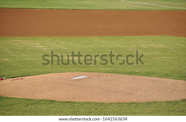 The pitcher\'s mound and part of the infield on a\
baseball field