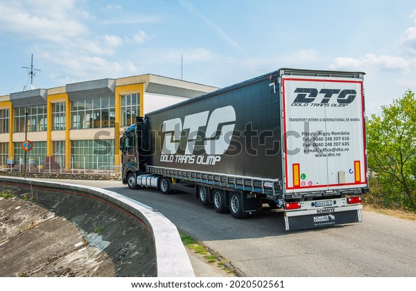 PITESTI ROMANIA August 2 2021 Black Mercedes-Benz\
Actros 1845 Euro 6 truck trailer in traffic. Mercedes-Benz Actros\
wins The Green Truck Award\
2015