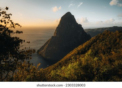 Pitons on Santa Lucia, La Souffriere bay during sunset with blue sky and cotton candy clouds. Caribbean Island. Vieux Fort, Saint Lucia. Travel and honeymoon concept.