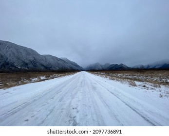 Pitt Meadows, BC, Canada. December 26, 2021.
Snowy Road In Pitt Meadows With Views Of Mountains. 