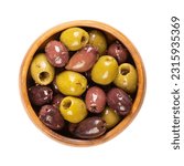Pitted Kalamata and green olives, in a wooden bowl. Mix of organic Greek olives, green and black, with herbs, preserved in native olive oil. Popular table olives, used as snack, appetizer or garnish.