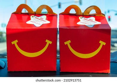 Pittsburg, CA, USA - January 5, 2022: Two McDonalds Happy Meal Boxes On The Dashboard Of A Car