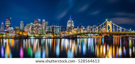 Pittsburgh downtown skyline panorama by night viewed from Allegheny Landing, between Roberto Clemente and Andy Warhol bridges