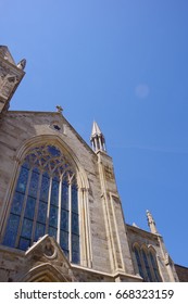 PITTSBURGH, PA -JUNE 3,2017:Saint Peter Catholic Church With Clear Blue Sky As Background.Closeup Of Beautiful Stained Glass Window At Pittsburgh, PA On June 3, 2017