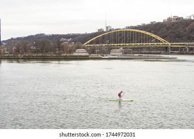 Pittsburgh, PA, USA, 2020-01-11: Person Doing Stand-up Paddleboarding On Pittsburgh Rivers